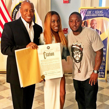 T'yanna accepting 'Biggie Day' citation from Brooklyn borough president.